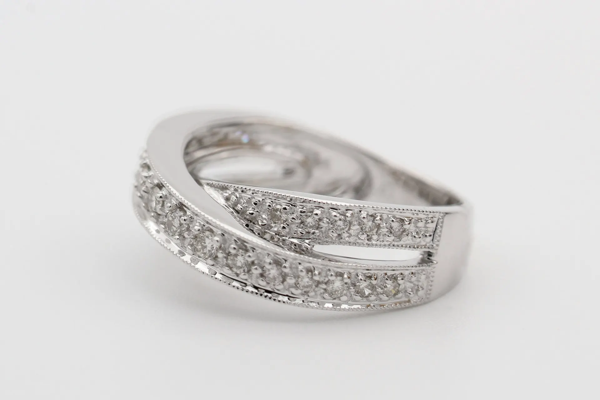 Industry context: Pavé-set rings on a pale surface.