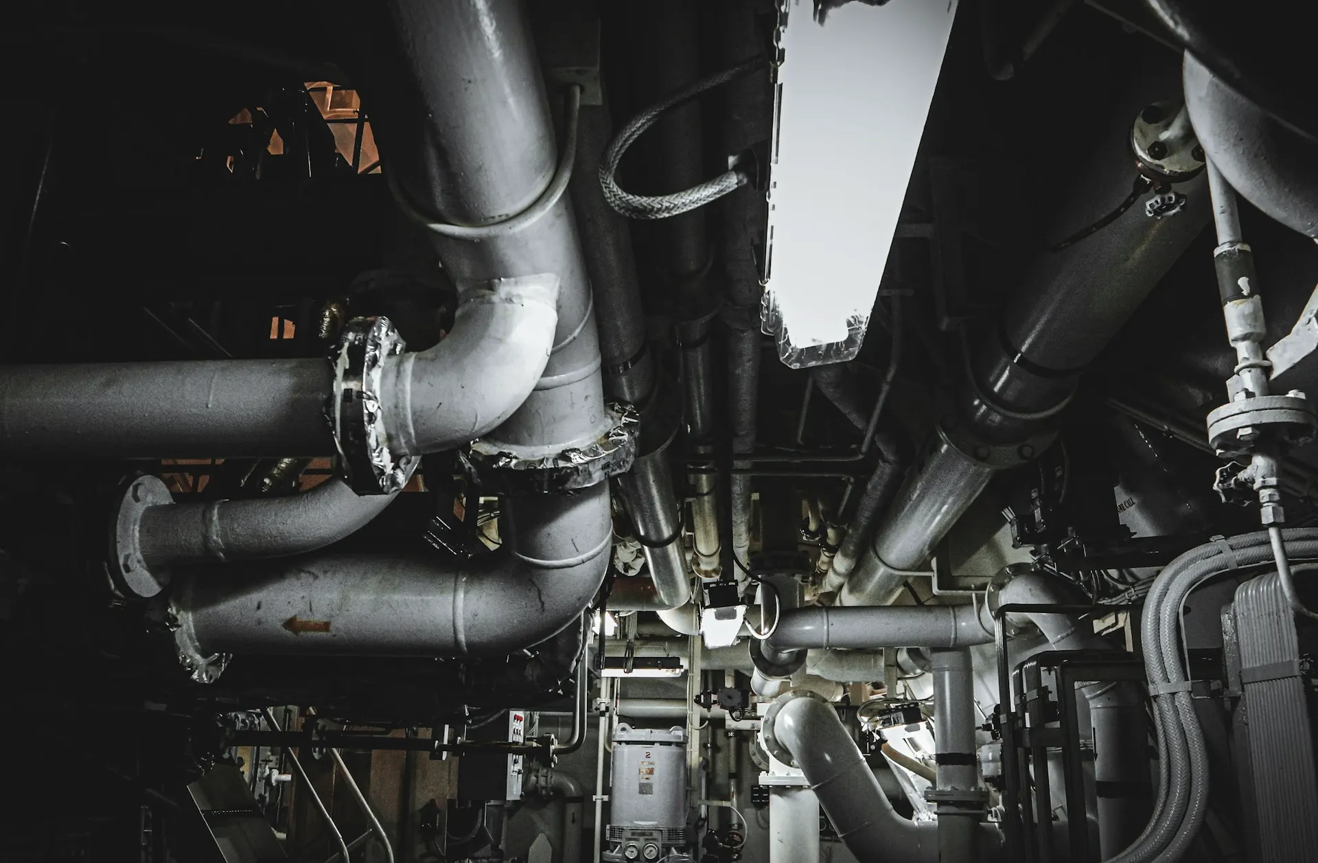 Industry context: Pipework inside an engine room.